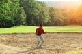 Blurred golfer happy for successful putt on the green Royalty Free Stock Photo