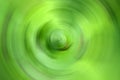 Blurred gradient radial motion green abstract background. Mixed circular texture