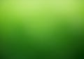 A blurred green background with a gradient effect, transitioning from lighter shades at Royalty Free Stock Photo