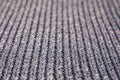 Blurred grey knitted fabric made of silvery yarn textured background.