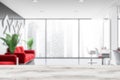Blurred hairdressing salon interior with red sofas