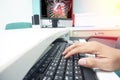 Blurred hand Doctor on the keyboard taking the CTA result to the patient. Displayed on the LCD monitor