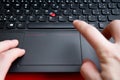 Blurred hands above the keyboard of red colored laptop Royalty Free Stock Photo