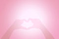 Blurred Heart made hands pink forming heart shape in soft pink pastel for banner card valentine background, Blurred Shadow Heart Royalty Free Stock Photo