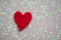 Blurred heart over abstract background with bokeh