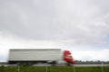 Blurred heavy truck on highway