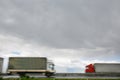 Blurred heavy trucks on highway