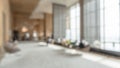 Blurred hotel or office building lobby blur background interior view toward reception hall, modern luxury white room