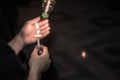 Blurred image for background of hand with candle memorable for King Bhumibol Adulyadej of thailand