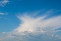 Blurred image of a blue sky with white clouds of various shapes Royalty Free Stock Photo