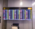 Blurred image of Boarding time monitor screens timetable boards for departures monitors to check status of flight on airport. Royalty Free Stock Photo