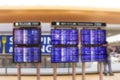 Blurred image of Boarding time monitor screens timetable boards for departures monitors to check status of flight on airport. Royalty Free Stock Photo