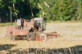 Blurred image of combine harvesting through grass