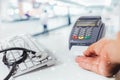 Blurred image of counter services in hospitals and paying with a credit card and using a terminal Royalty Free Stock Photo