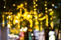 Blurred image Decorative outdoor string lights hanging on tree in the garden at night time festivals season - decorative Christmas Royalty Free Stock Photo