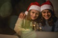 Blurred image, festive background. Two young happy beautiful women girlfriends lesbian couple with glasses of champagne Royalty Free Stock Photo