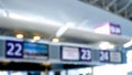 Blurred image of information boards and displays in airport terminal Royalty Free Stock Photo
