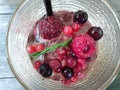 Blurred image of mixed fruit on fresh drink in glass as a background