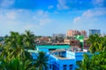 Blurred image, modern and old architecture of buildings, blue sky and white clouds in background. Kolkata, West Bengal, India Royalty Free Stock Photo