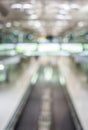 Blurred image of moving modern escalator way in the airport hall Royalty Free Stock Photo