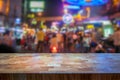 Blurred image of people walking at a busy street with neon signs at night. Royalty Free Stock Photo