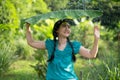 Blurred image portrait of a young Asia woman with black hair holding a banana leaf