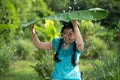 Blurred image portrait of a young Asia woman with black hair holding a banana leaf