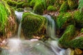 Blurred image of a small river waterfall close-up long exposure Royalty Free Stock Photo