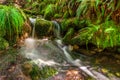 Blurred image of a small river waterfall close-up long exposure Royalty Free Stock Photo