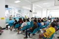 Blurred image of unidentified people and patient waiting doctor or medicine