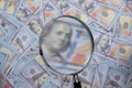 us dollar bill through magnifying lens checking banknotes Royalty Free Stock Photo
