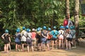 Blurred image of Visitors listen to the Tourist Guide before playing a zip-line.