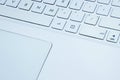 Blurred image of white laptop kayboard,  close up. Royalty Free Stock Photo