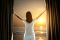 Blurred image of that woman in the bedroom window She opened the curtain at the window In the morning and she had a sea view Royalty Free Stock Photo