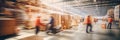 Blurred image of workers or warehouse employees in action, moving shipment boxes efficiently, showcasing the dynamics of Royalty Free Stock Photo