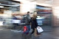 Blurred image of young people in shopping center