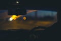 Blurred images of the driver and windshield at night with poor headlights and the road. front and back background blurred with Royalty Free Stock Photo