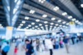 Blurred images of trade fairs in the big hall. image of people walking on a trade fair exhibition or expo where business people Royalty Free Stock Photo