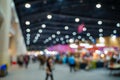 Blurred images of trade fairs in the big hall. image of people walking on a trade fair exhibition or expo where business people Royalty Free Stock Photo