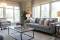 Blurred interior of light living room with grey sofas, coffee table and big window Royalty Free Stock Photo