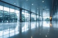 Blurred interior perspective: Glass entrance doors frame the view of empty office lobby. Royalty Free Stock Photo