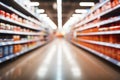 Blurred interior of a supermarket store aisle, creating an abstract backdrop Royalty Free Stock Photo