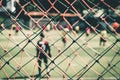 Blurred Soccer match training for children sport training background, Children football academy match behind the net Royalty Free Stock Photo