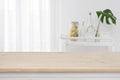 Blurred kitchen window, shelves background with wooden tabletop in front Royalty Free Stock Photo