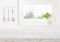 Blurred kitchen window sill background and vintage wooden table space Royalty Free Stock Photo