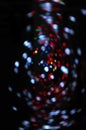 Blurred LED screen closeup. Glowing threads in a color spectrum on a black background Royalty Free Stock Photo