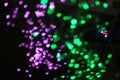 Blurred LED screen closeup. Glowing threads in a color spectrum on a black background Royalty Free Stock Photo