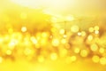 Blurred light bokeh on sunset, yellow string lights in outdoor restaurant, abstract background Royalty Free Stock Photo