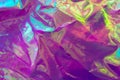 Blurred light rainbow crumpled holographic background