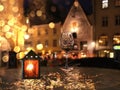 Blurred light ,Red Lantern  ,Night Street restaurant  in Tallinn old town medieval city  and glass of wine on Table top  Estonia Royalty Free Stock Photo